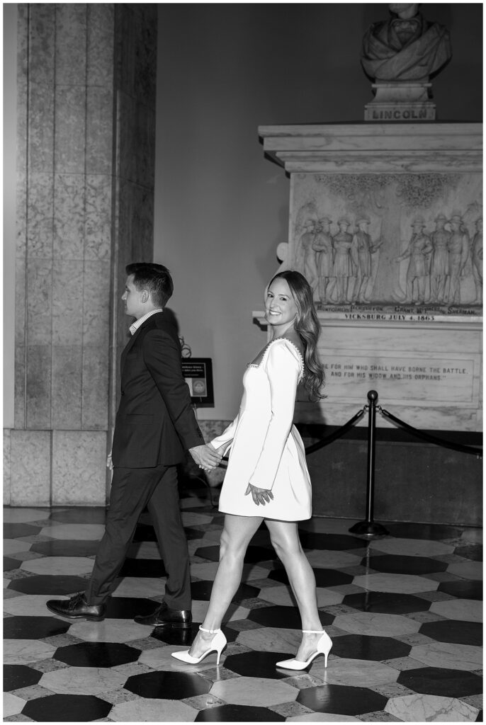 Couple walking hand-in-hand on Ohio Statehouse grounds during a documentary-style session