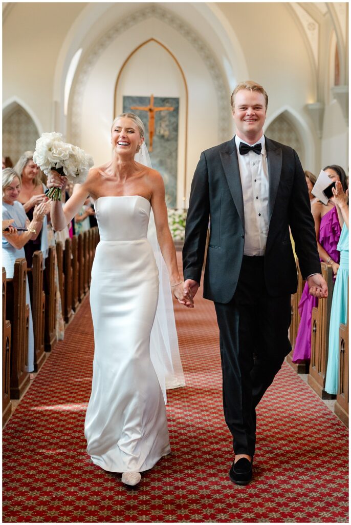 Newlyweds walking down the aisle after their wedding ceremony
