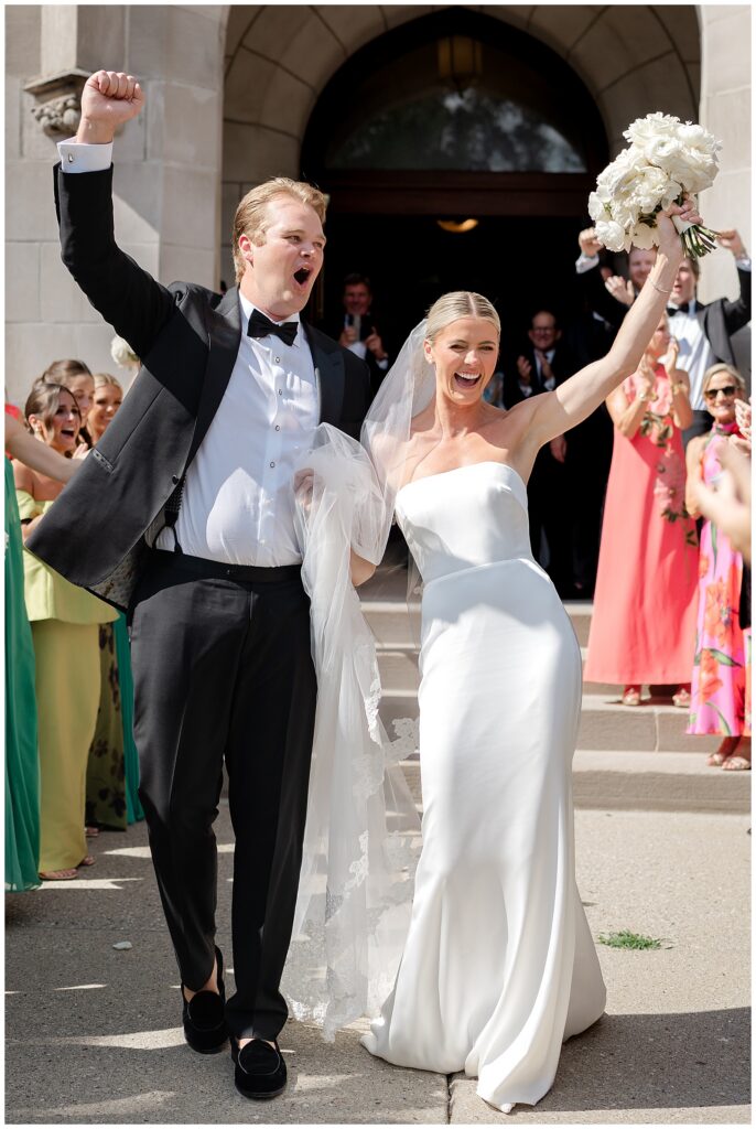 Newlyweds leaving Sacred Heart Church after their Winnetka wedding